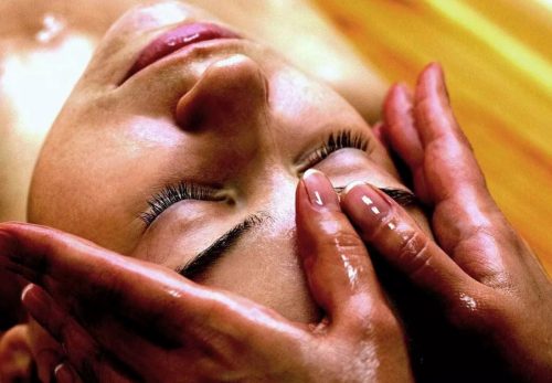 Facial massage with sage oil