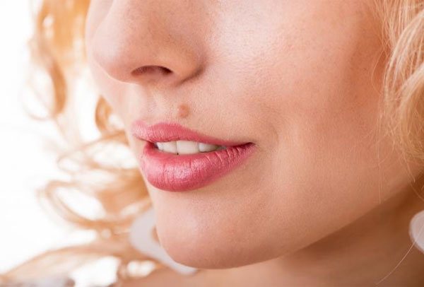 Pimple on a mole: why it forms and what to do.